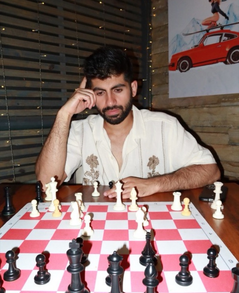 Rahul Dhiman at a chessboard